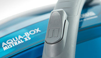 Grey hose handle with a flap for mechanical suction power adjustment